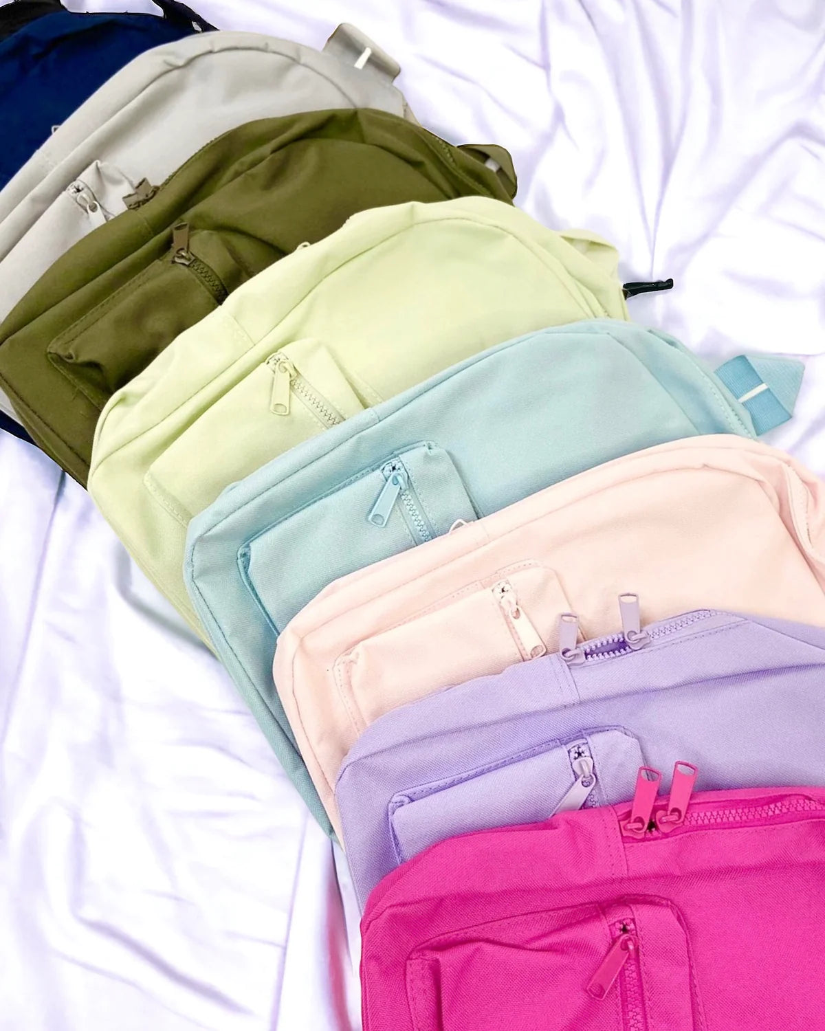 10 colour options for personalised kids backpack - including Light blue, navy, white, black, light pink, lavender, pistachio, olive and natural