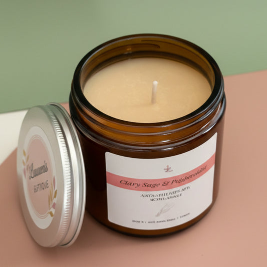 Candle in an open jar with a pink background