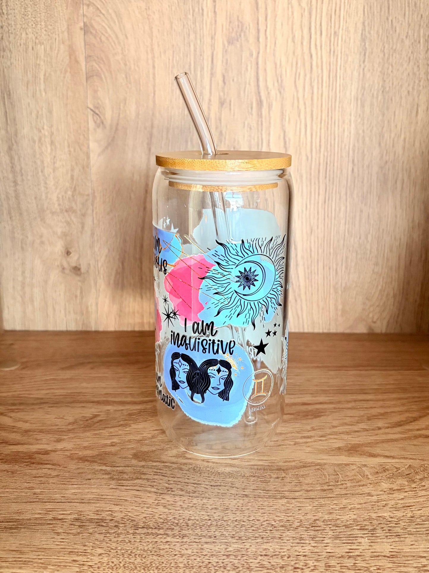 Gemini zodiac glass can side view with celestial sun and moon design