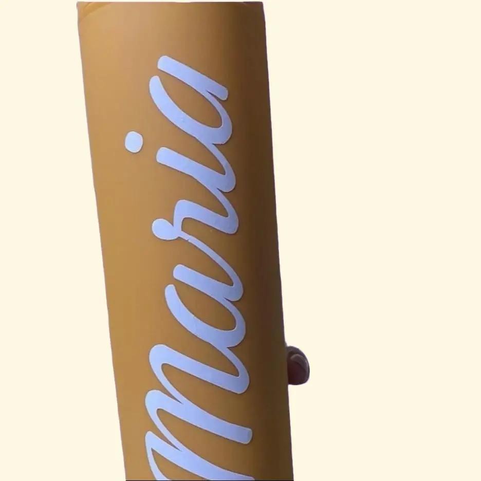 Gold tumbler product with 'Maria' written on it against a beige background