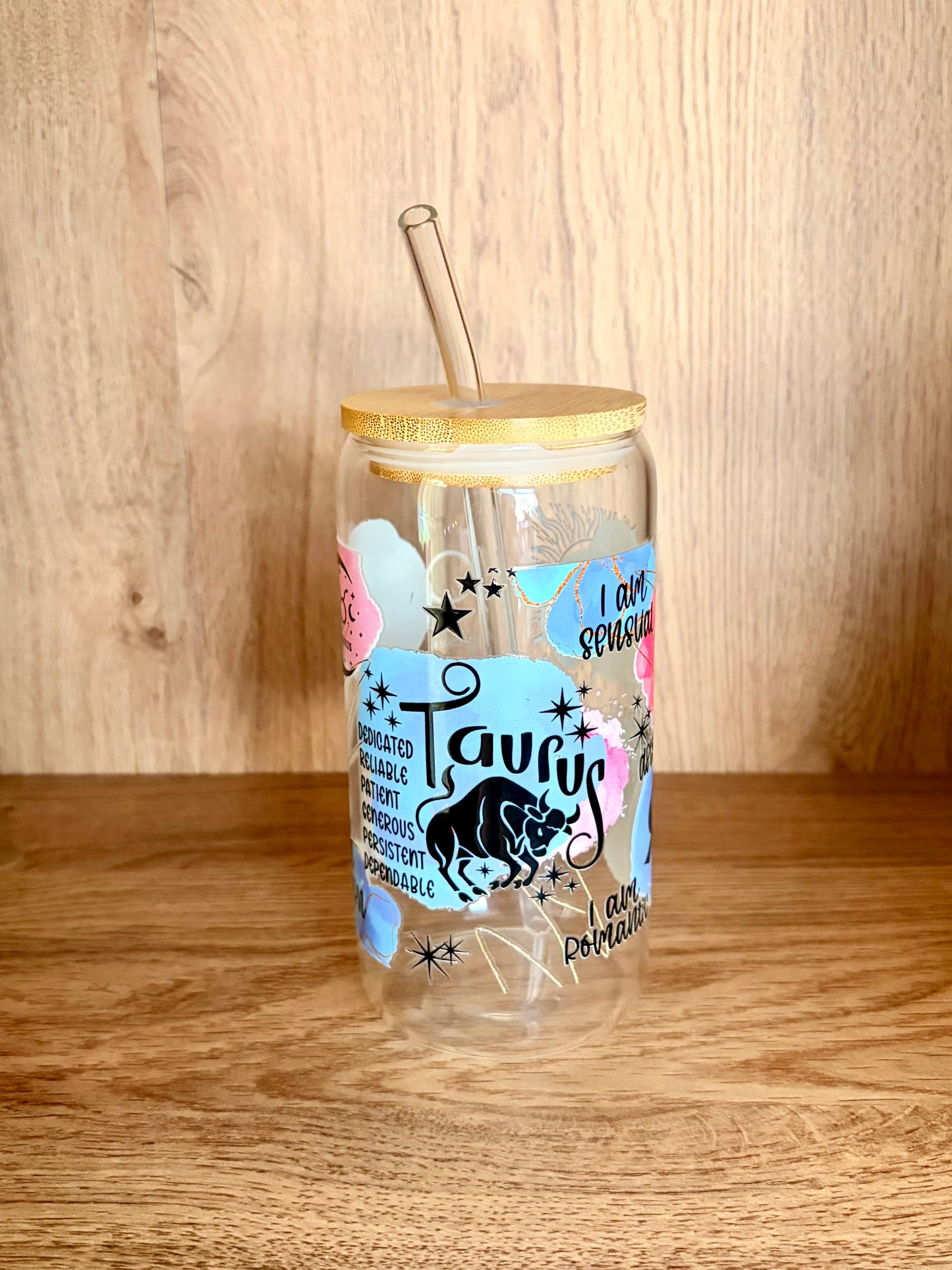 Taurus zodiac glass can showing I am loyal, I am logical, I am stubborn affirmations with celestial moon design