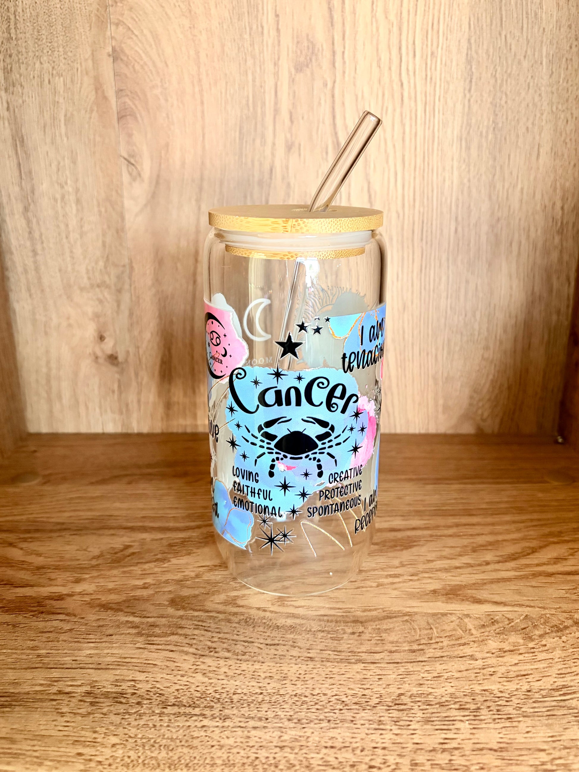 Cancer zodiac glass can showing Cancer script lettering with crab illustration and traits: loving, faithful, emotional, creative, protective, spontaneous