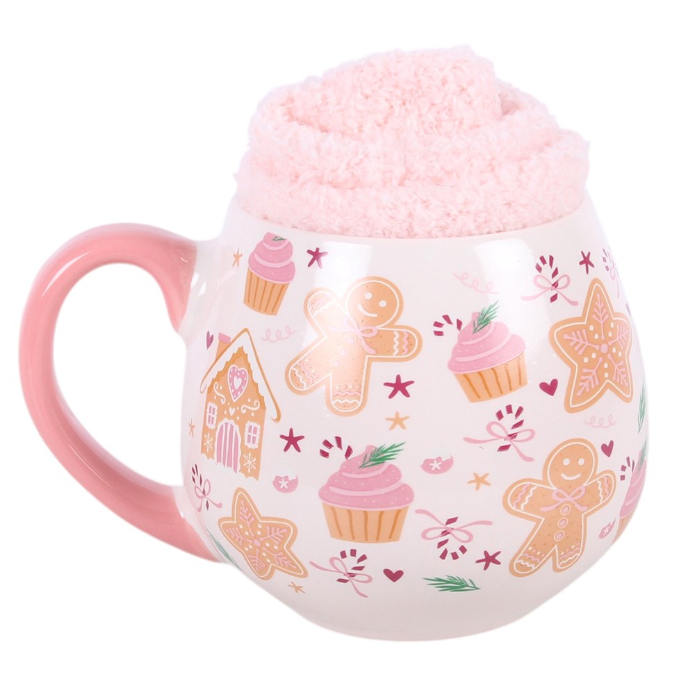 Mug with pink handle and festive design on a white background