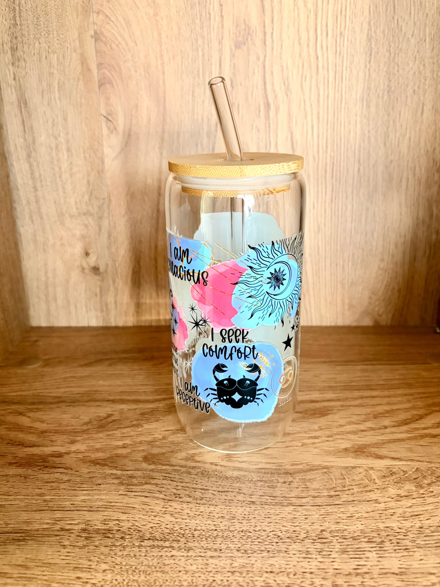 Cancer zodiac glass can showing I am tenacious, I seek comfort, I am protective affirmations with sun and moon illustration