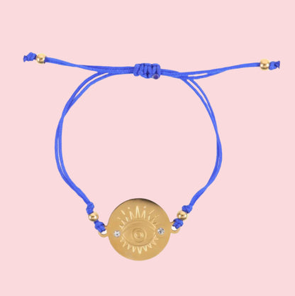 matching gold bracelet with evil eye charm for good luck