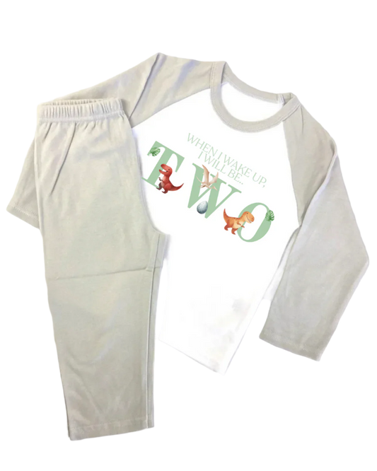 Grey and white dinosaur birthday pyjamas with custom name and age