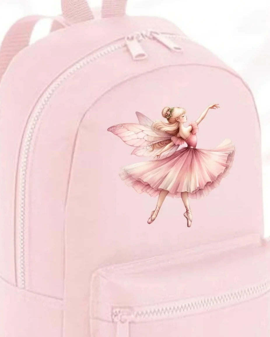 Pink backpack with a fairy design on a white background