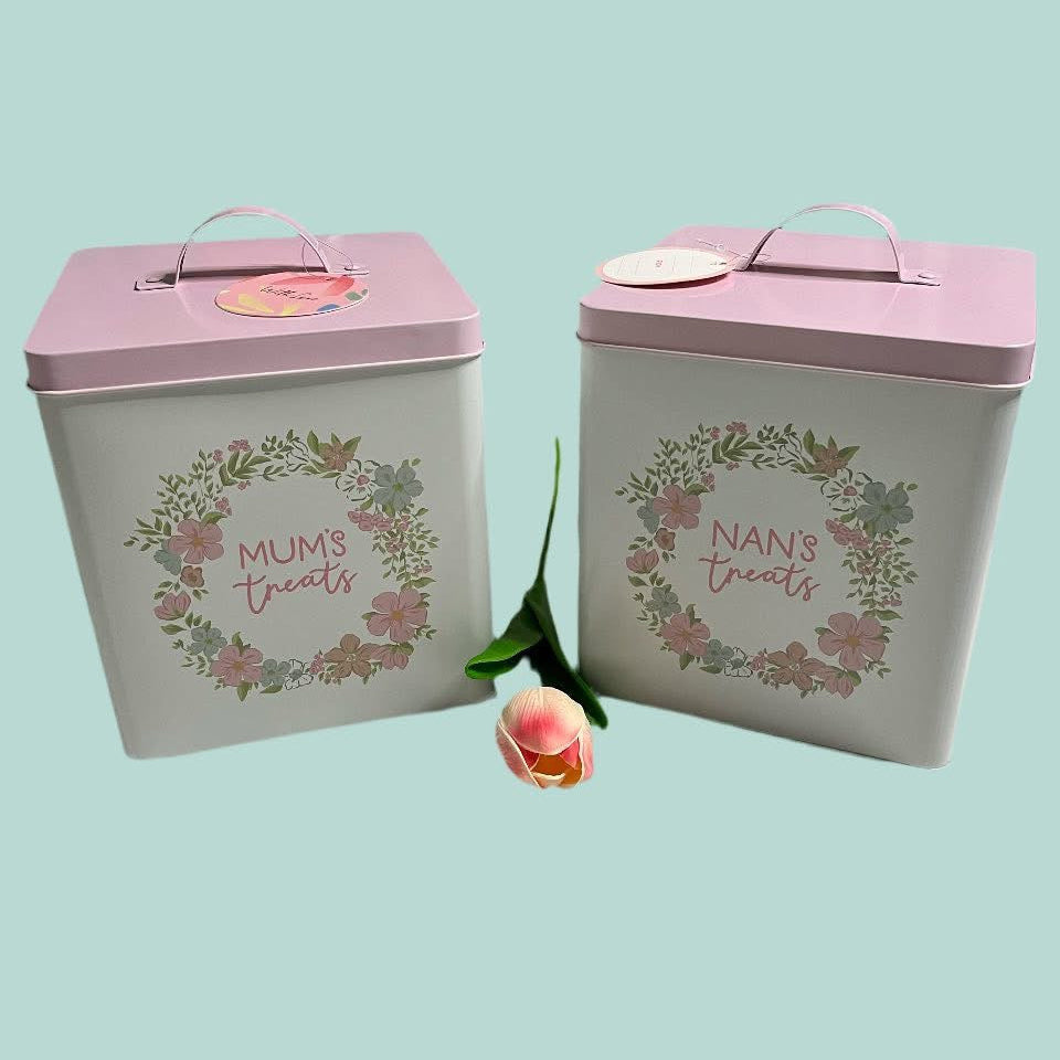 Two decorative storage boxes with floral designs and text on a light blue background