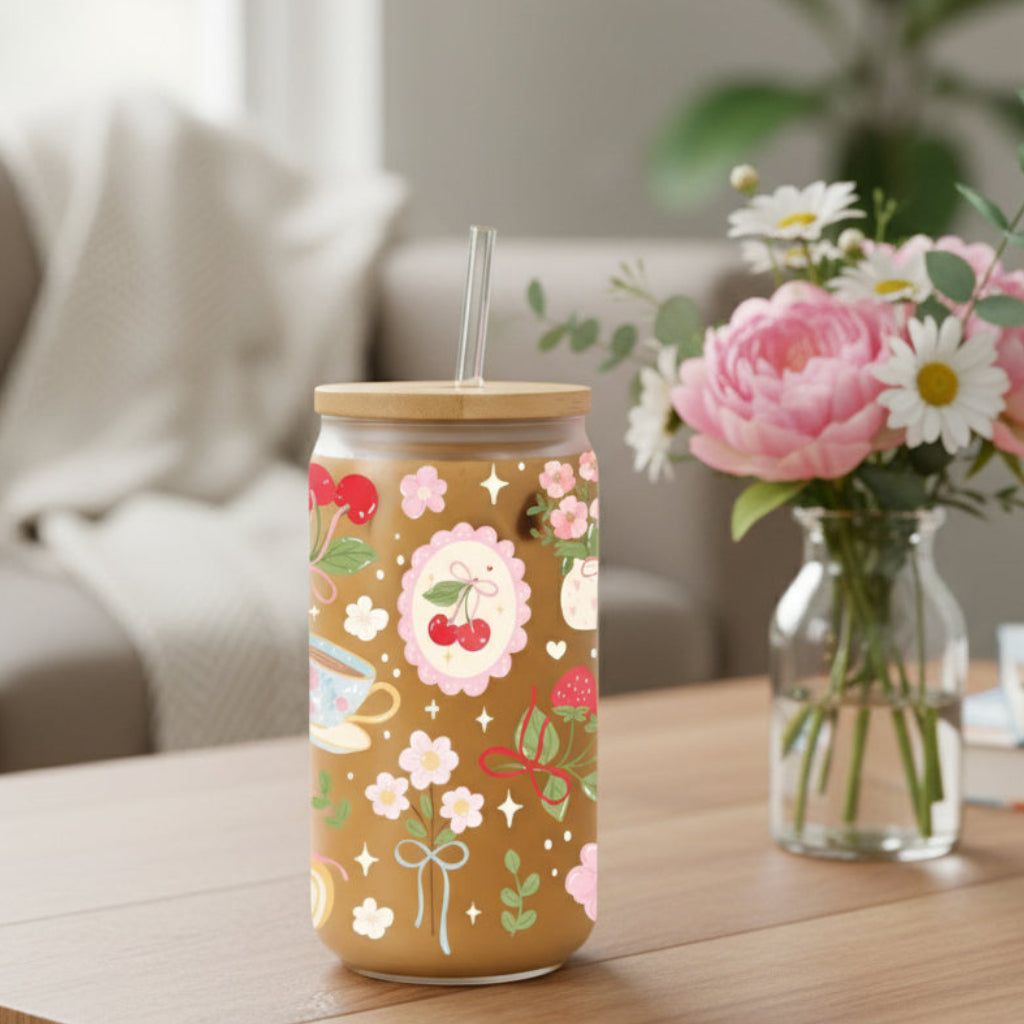 glass can with cherry and floral design with a vase and flowers
