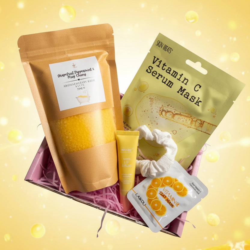 Assorted skincare products including a bath salts, serum mask, and facial masks on a textured surface.