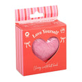 Pink heart-shaped bath bomb in a 'Love Yourself' branded box on a white background