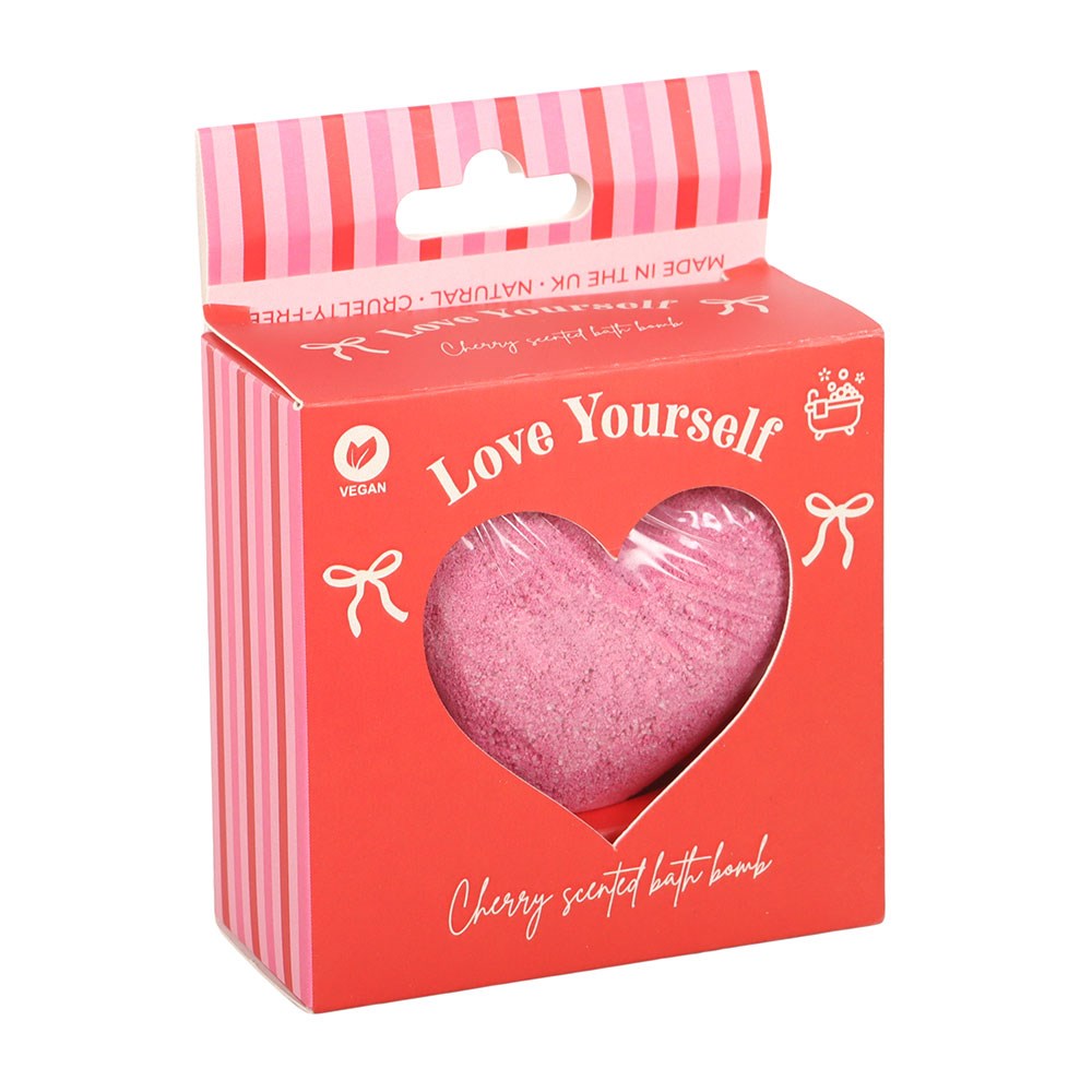 Pink heart-shaped bath bomb in a 'Love Yourself' branded box on a white background