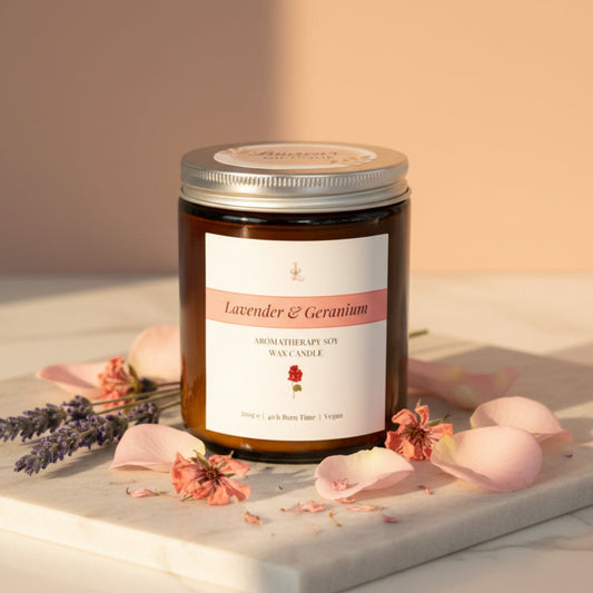 Jar of lavender and geranium candle on a pink and beige background