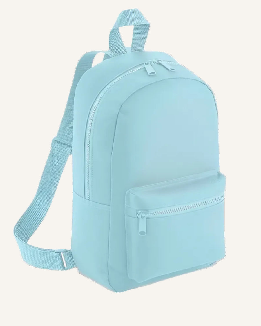 Light blue backpack on a ivory background