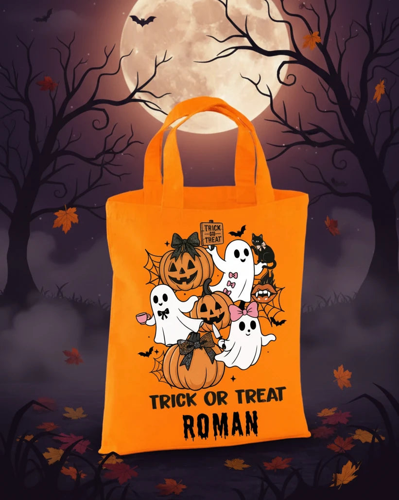 Orange mini tote bag with hallow design and ‘trick or treat’ with the name Roman on a Halloween evening background with the moon. 