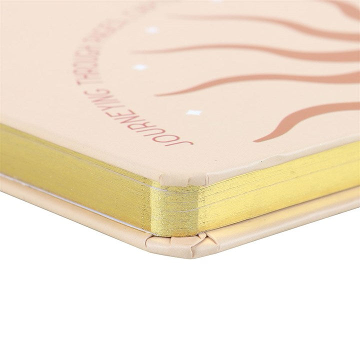 close up of gold edged notebook pages