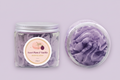 Jar of Sweet Plum & Vanilla whipped soap with a lid removed on a lilac background