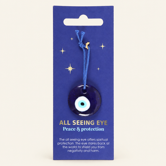 All Seeing Eye charm on a warm ivory background