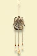 Decorative hanging angel with chains and bells on a yellow background