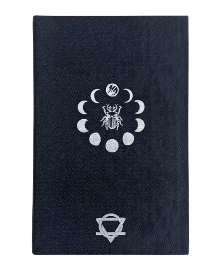 Black book with white embossed symbols on a white background