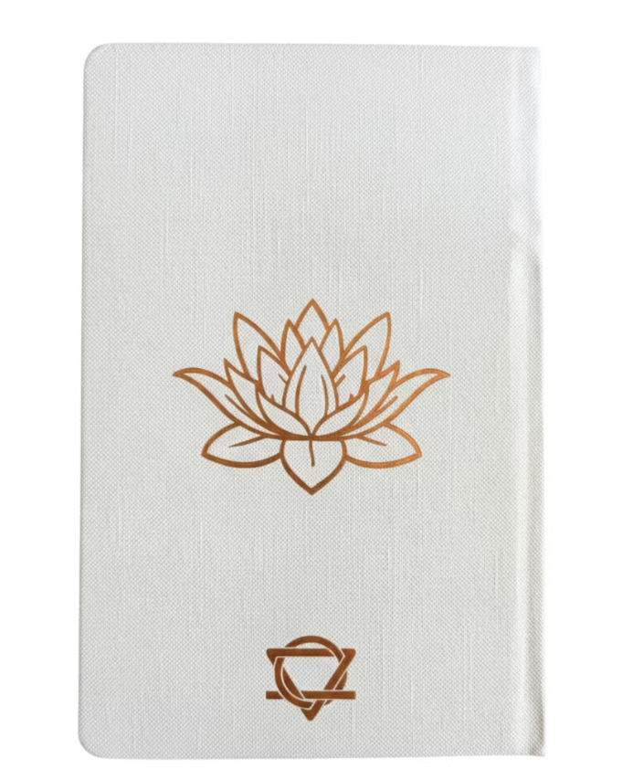 Notebook with a gold lotus flower design on a white background