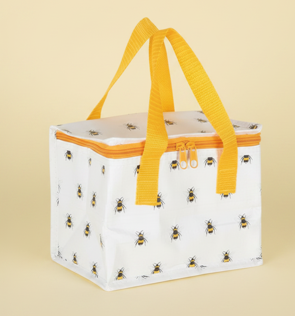 White cooler bag with bee pattern and yellow handles on a white background