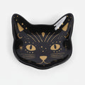 Black cat-shaped dish with gold accents on a grey background