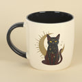 Mug with a black cat design on a beige background