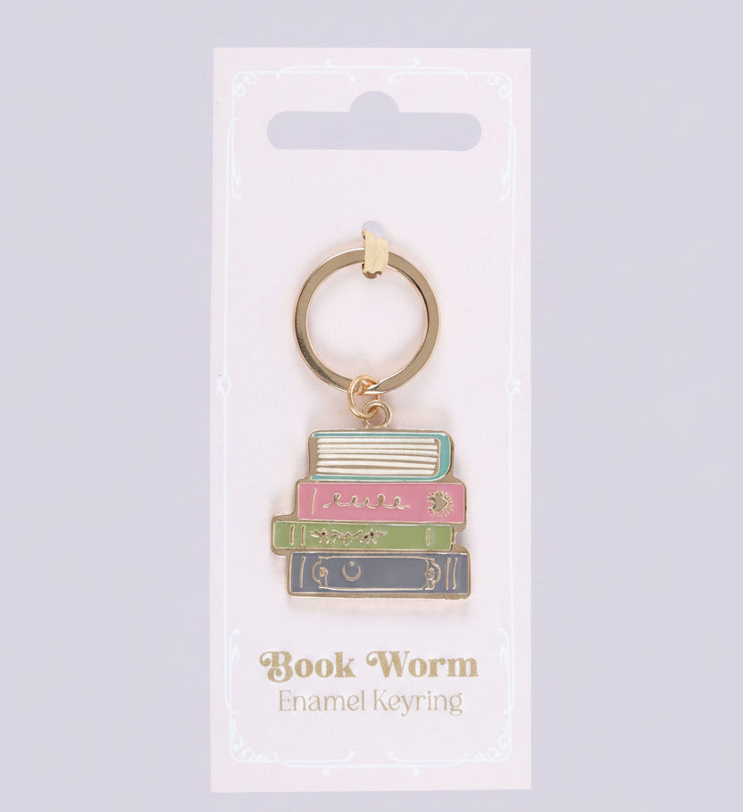 Book-themed keychain on a white card with 'Book Worm Enamel Keyring' text.