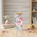 glass can with 'in my bookish girly era' design on a table with books and decor