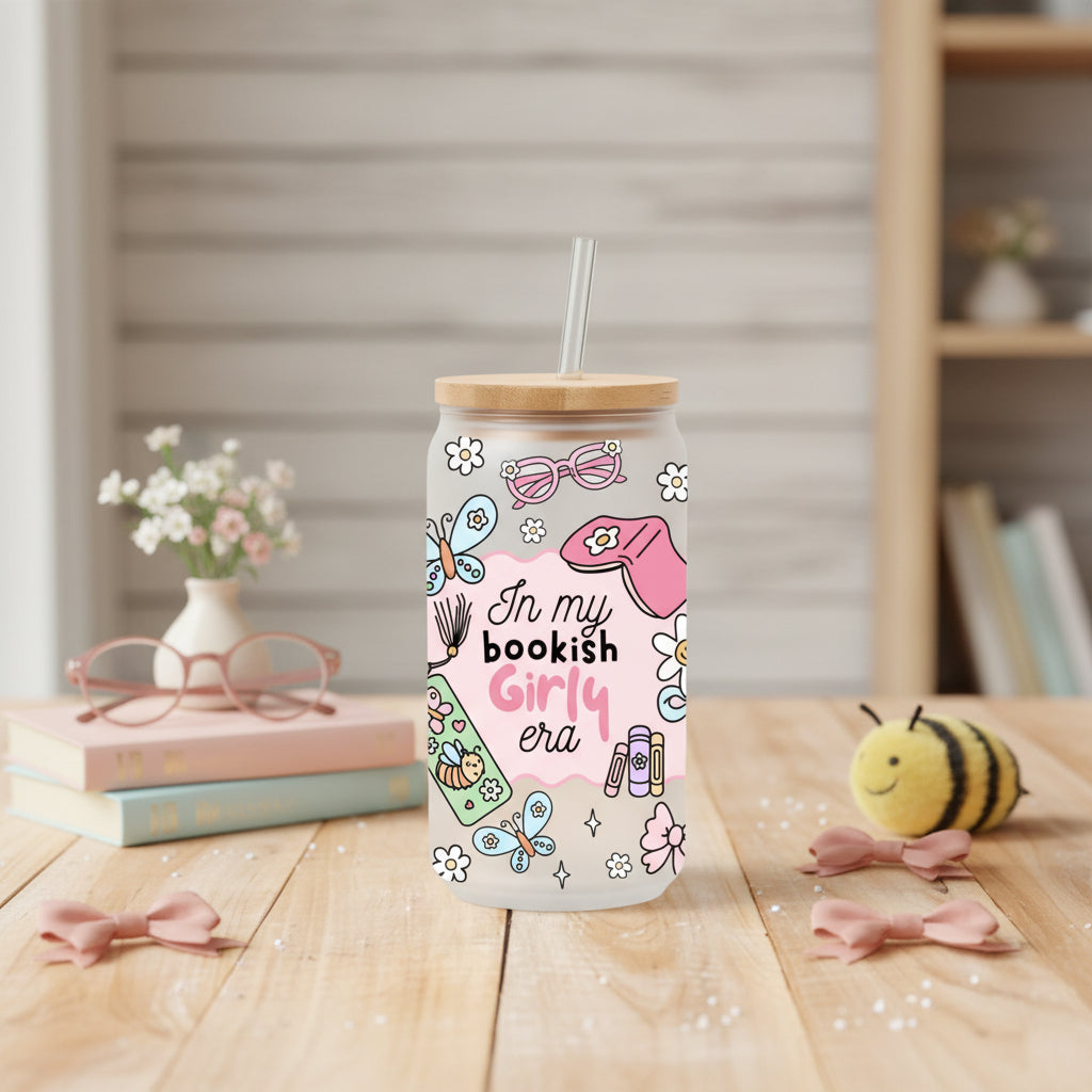 glass can with 'in my bookish girly era' design on a table with books and decor