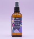 Room spray bottle with a colorful label on a purple background
