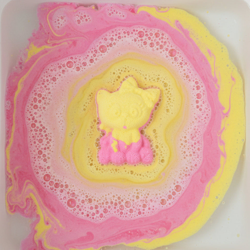 Yellow and pink cat-shaped bath bomb on a water liquid background