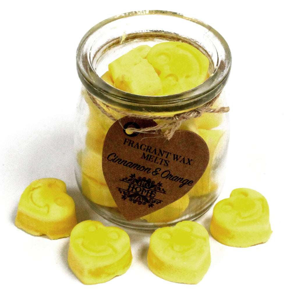 Jar of fragrant wax melts with a heart-shaped tag on a white background