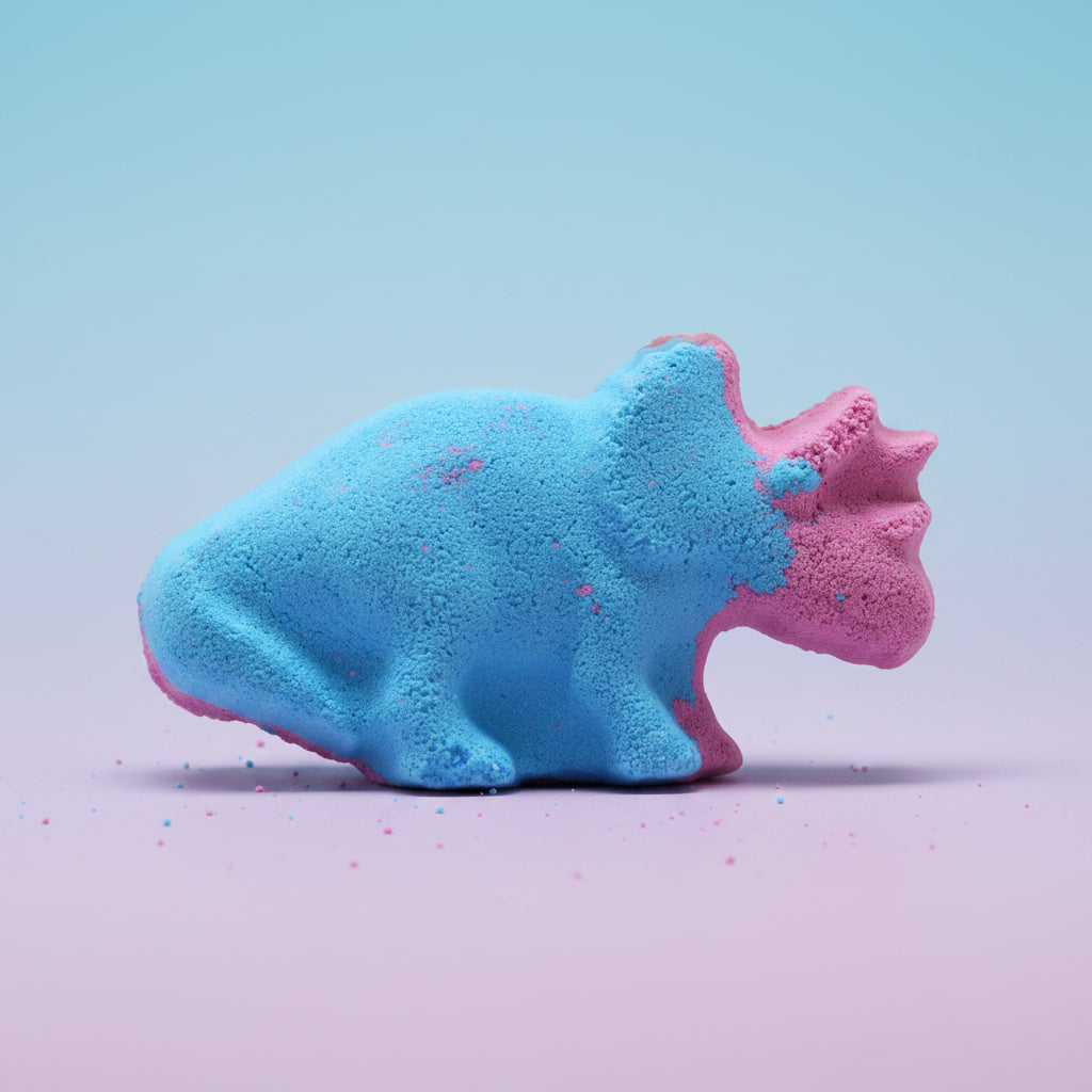 Blue and purple dinosaur-shaped bath bomb on a blue/purple background