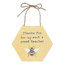 Hexagonal wooden sign with bee illustration and text on a white background