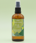 fresh vetiver room spray bottle on a green background