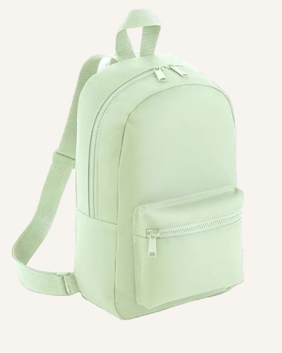 Light green backpack on a ivory background