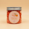 Jar of Island Sunset whipped soap on a contrasting background