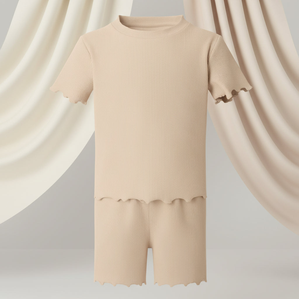 Beige top and shorts set on a neutral background