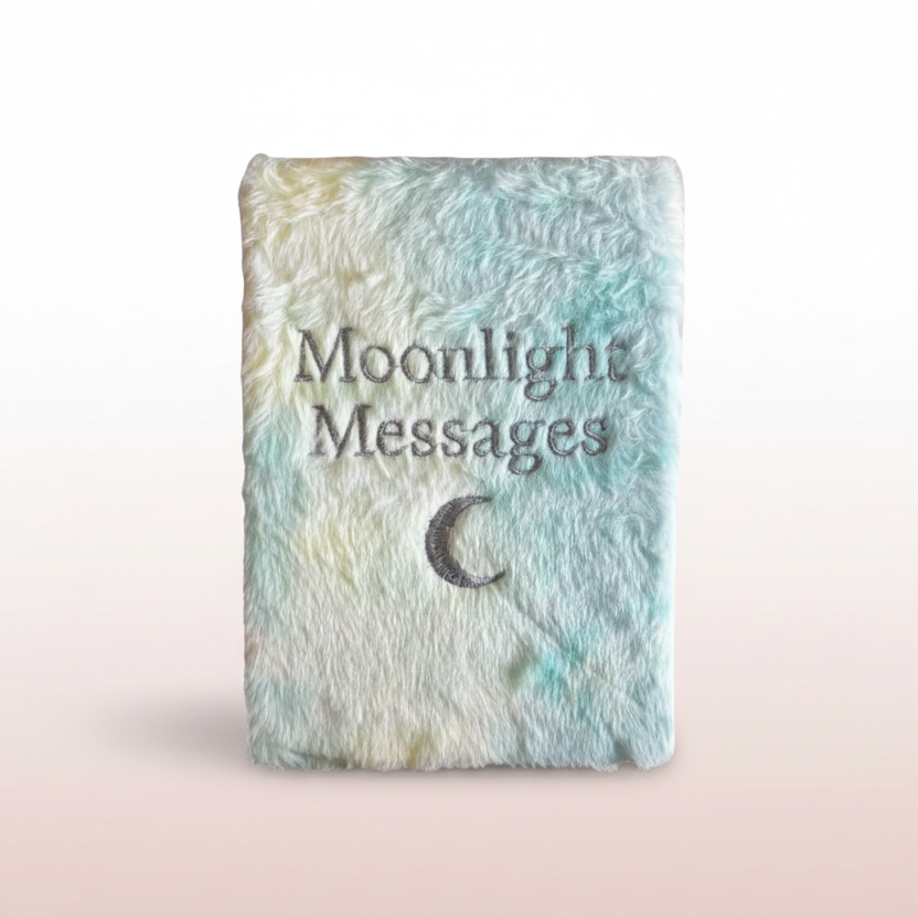 Textured notebook with 'Moonlight Messages' and a moon symbol on a pastel background