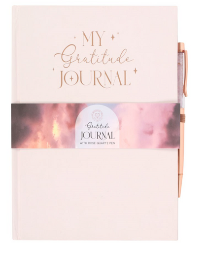 Gratitude journal with pink cover and rose gold accents on a white background