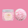 Pink lemon fizz whipped soap in a container with a silver lid on a pink background