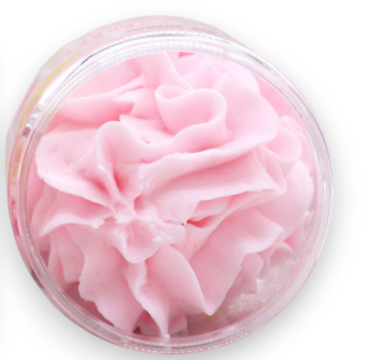 Pink lemonade whipped soap in a container  on a white background