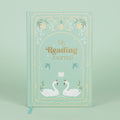 Journal with swan design and 'My Reading Journal' text on a light blue background