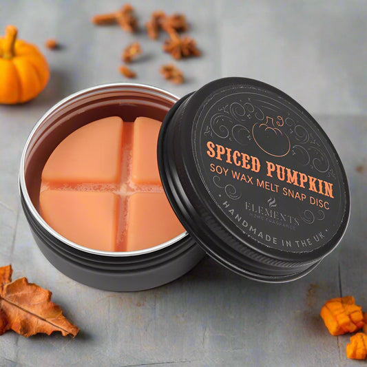 Spiced Pumpkin soy wax melt snap disc in a black container with 'Elements' branding.