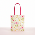 tote bag with florals and duck print on a pink background