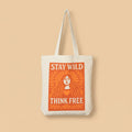 Tote bag with 'Stay Wild Think Free' text and design on a orange background