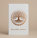 Wellness journal with tree of life design and moon phases on a light bronze background