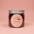 Jar of Velvet Cherry whipped soap on a pink background